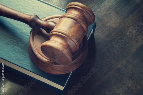 Obraz na plátne Judge gavel and legal book on wooden table close up