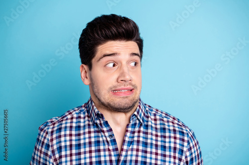 Close up photo of disappointed horrified man anxious stupor have failure want disappear frightened dressed checkered modern clothing isolated pastel background