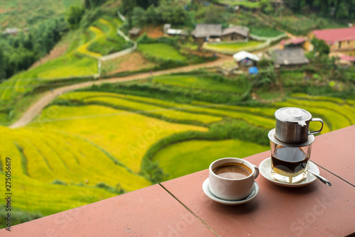 Drip Black Coffee vietnamese style on balcony with alpine background - can be used for display or montage your text (soft focus at cup) photo