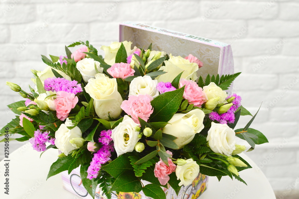 beautiful floral arrangement in a hat box 