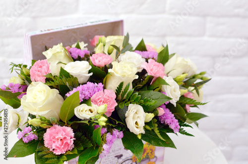 beautiful floral arrangement in a hat box 