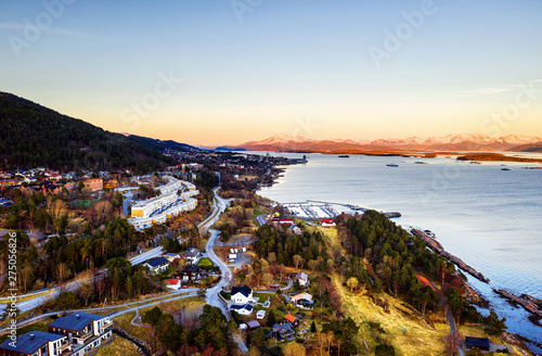 Aerial view of residential area in Molde, Norway in the evening. Beautiful fjord © Madrugada Verde