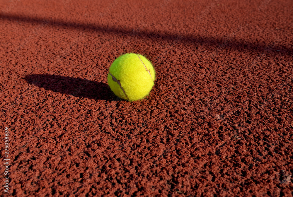 Tennis ball in a court. Useful for tennis background designs.