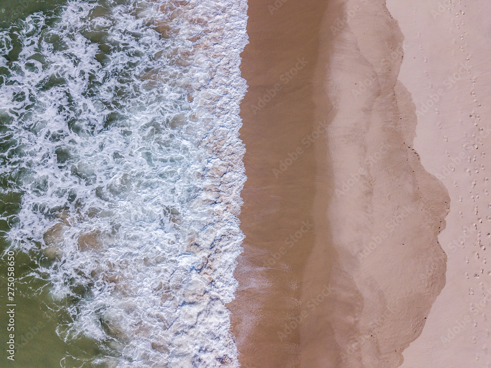 Drone picture of waves hitting the beach. Drone picture of waves hitting the beach.