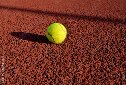 Tennis ball in a court. Useful for tennis background designs.