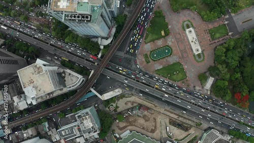 4K Aerial Footage Flying Over Busy Highway Intersection With Lots of afternoon Traffic in Bangkok, Thailand photo