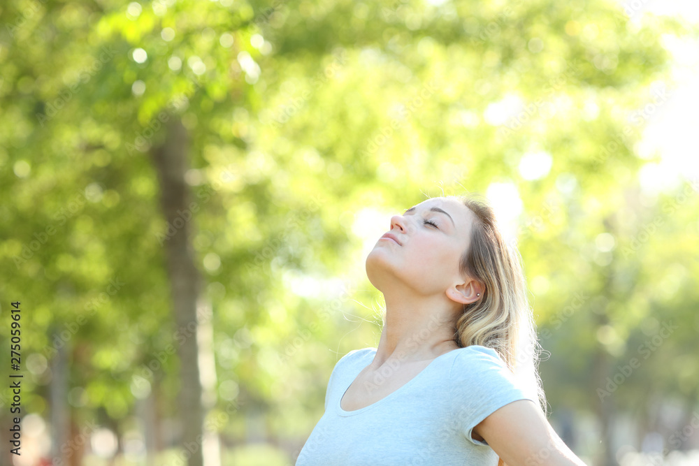Relaxed teenage girl breathing fresh air in a park Relaxed teenage girl breathing fresh air in a park