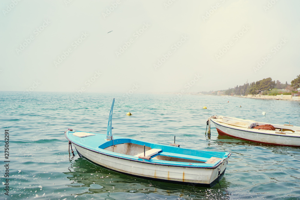 Beautiful landscape with seashore and fishing boat.