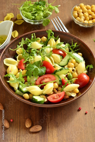 Mediterranean pasta salad with vegetables and chickpeas  vertical 
