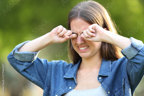 Woman suffering itching scratching eyes