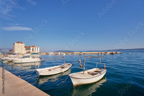 Kastel coast in Dalmatia Croatia. A famous tourist destination on the Adriatic sea. Fishing boats moored in old town harbor.