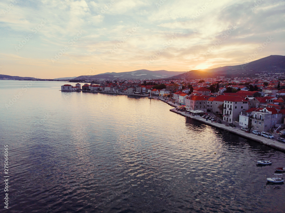 Beautiful sunset landscape. Aerial shot of the Kastel coast in Dalmatia,Croatia.Old town near Adriatic sea.