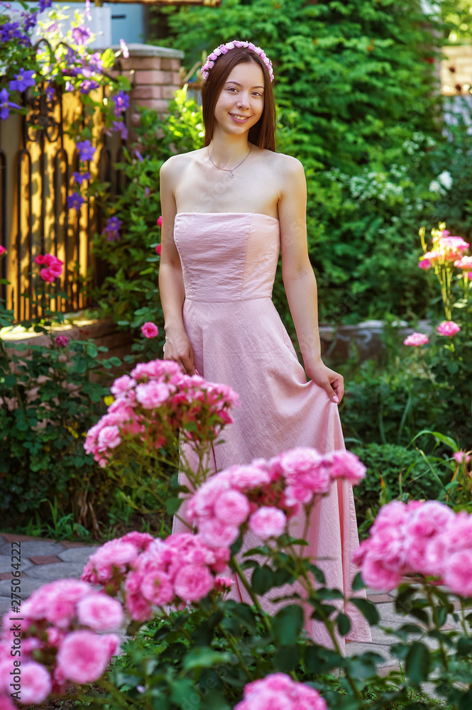 Young woman in evening dress in nature