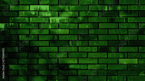 Facade vintage brick stone wall green texture background.