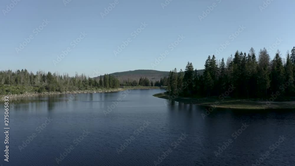 Flying over a beautiful lake in the harz national forest, Germany Flying over a beautiful lake in the harz national forest, Germany