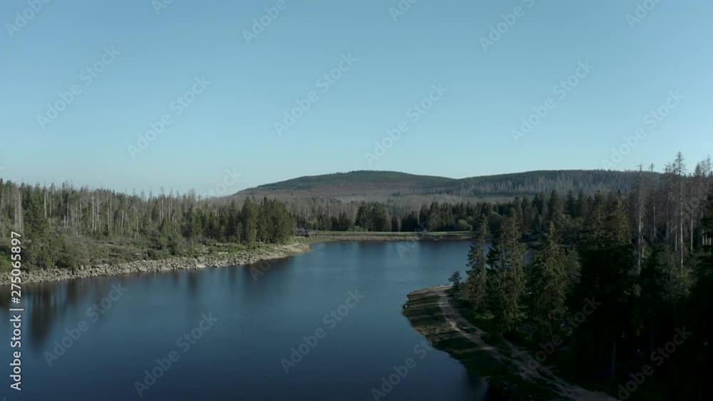 Drone Aerial Shot of a beautiful lake in the harz national forest, Germany Drone Aerial Shot of a beautiful lake in the harz national forest, Germany