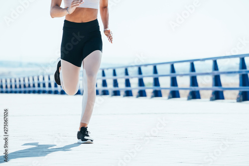 Outdoor shot of a fit young woman running.