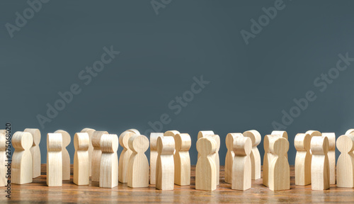 Картината върху платно A crowd of wooden figures of people