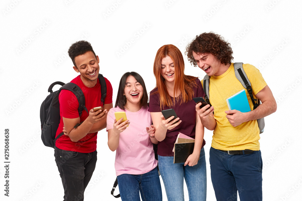 Happy international students using smartphones Happy international students using smartphones