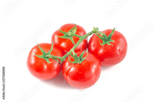Fresh tomatoes with green leaves isolated on white background.