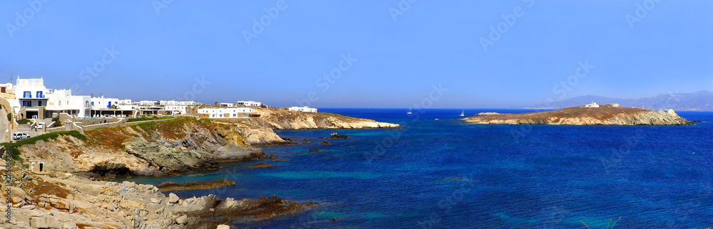 Tip of the peninsula of Diakoftis, facing the chapel Saint George (Agios Georgiou), in Mykonos, island of Cyclades in the heart of the Aegean Sea Tip of the peninsula of Diakoftis, facing the chapel Saint George (Agios Georgiou), in Mykonos, island of Cyclades in the heart of the Aegean Sea