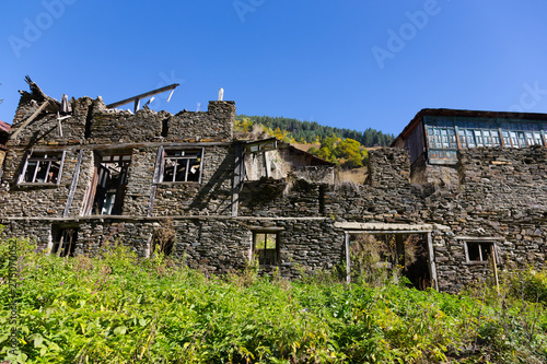 Old ruined stone house. Autumn mountain landscape in Svaneti. Georgia
