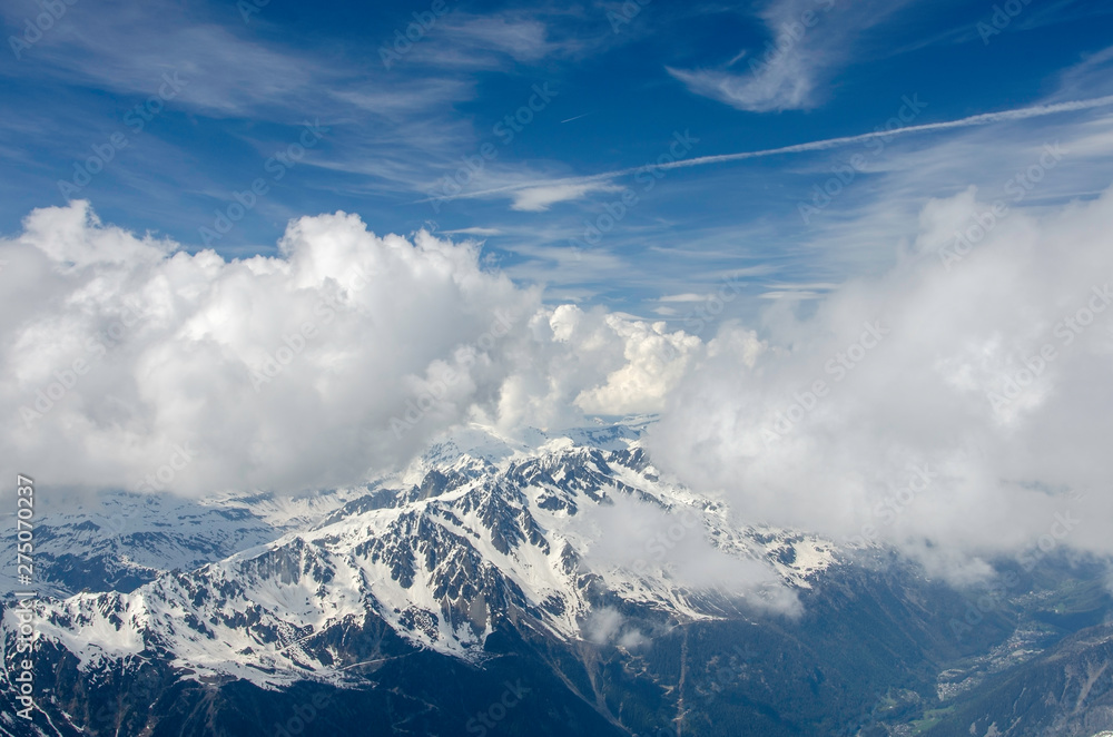 Air view. Beautiful dramatic cloudy sky , mountains and snow peaks. Mont Blanc. Chamonix. France