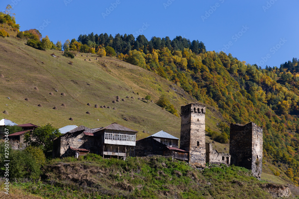 Beautiful autumn mountain landscape with svans tower in Svaneti. Georgia