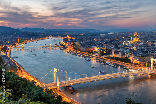 Aerial view of Budapest at sunset with lights on