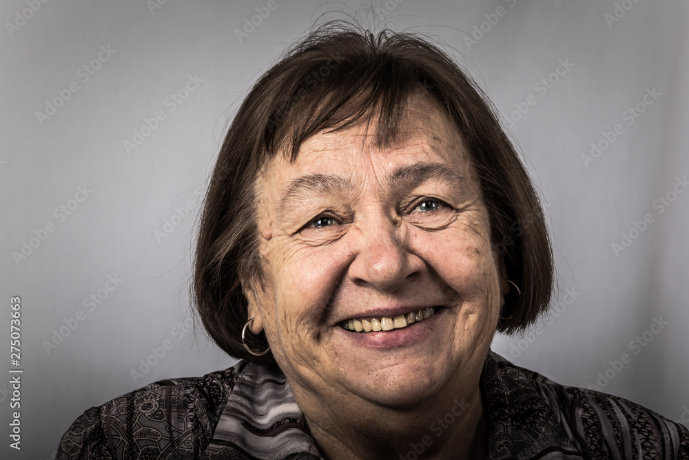 Portrait of an elderly laughing woman. Toned Portrait of an elderly laughing woman. Toned