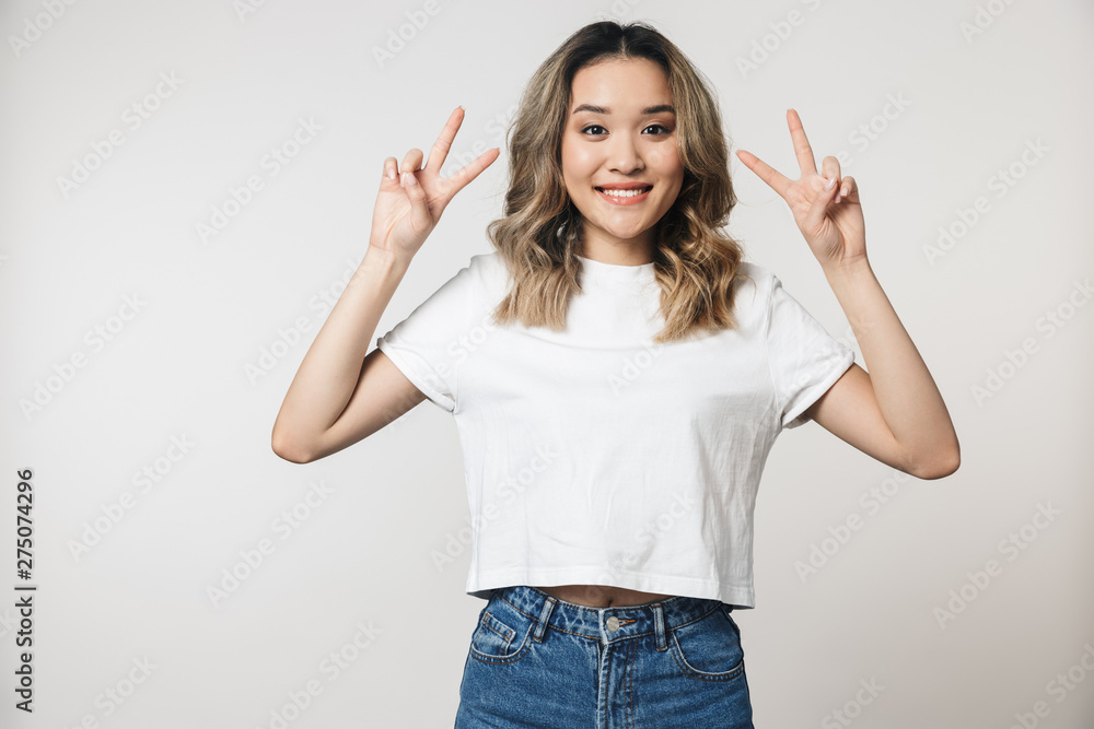 Portrait of a lovely young asian woman standing isolated Portrait of a lovely young asian woman standing isolated