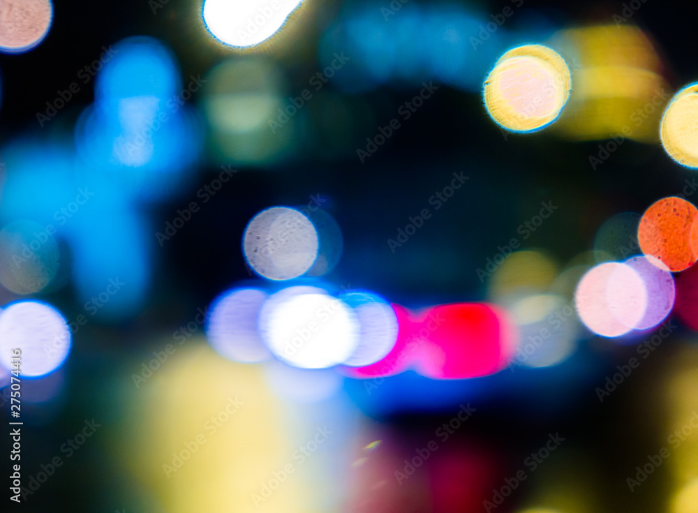 Abstract blurred background of night city.Night traffic,colorful lights Abstract blurred background of night city.Night traffic,colorful lights