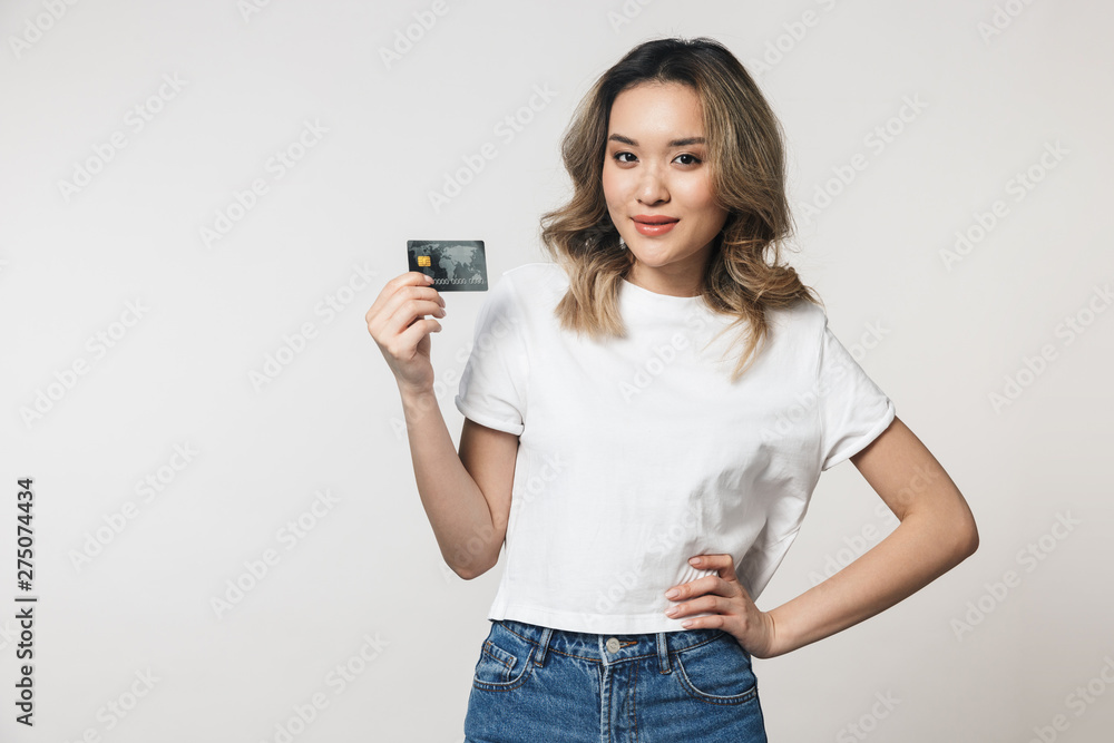 Portrait of a lovely young asian woman standing isolated Portrait of a lovely young asian woman standing isolated