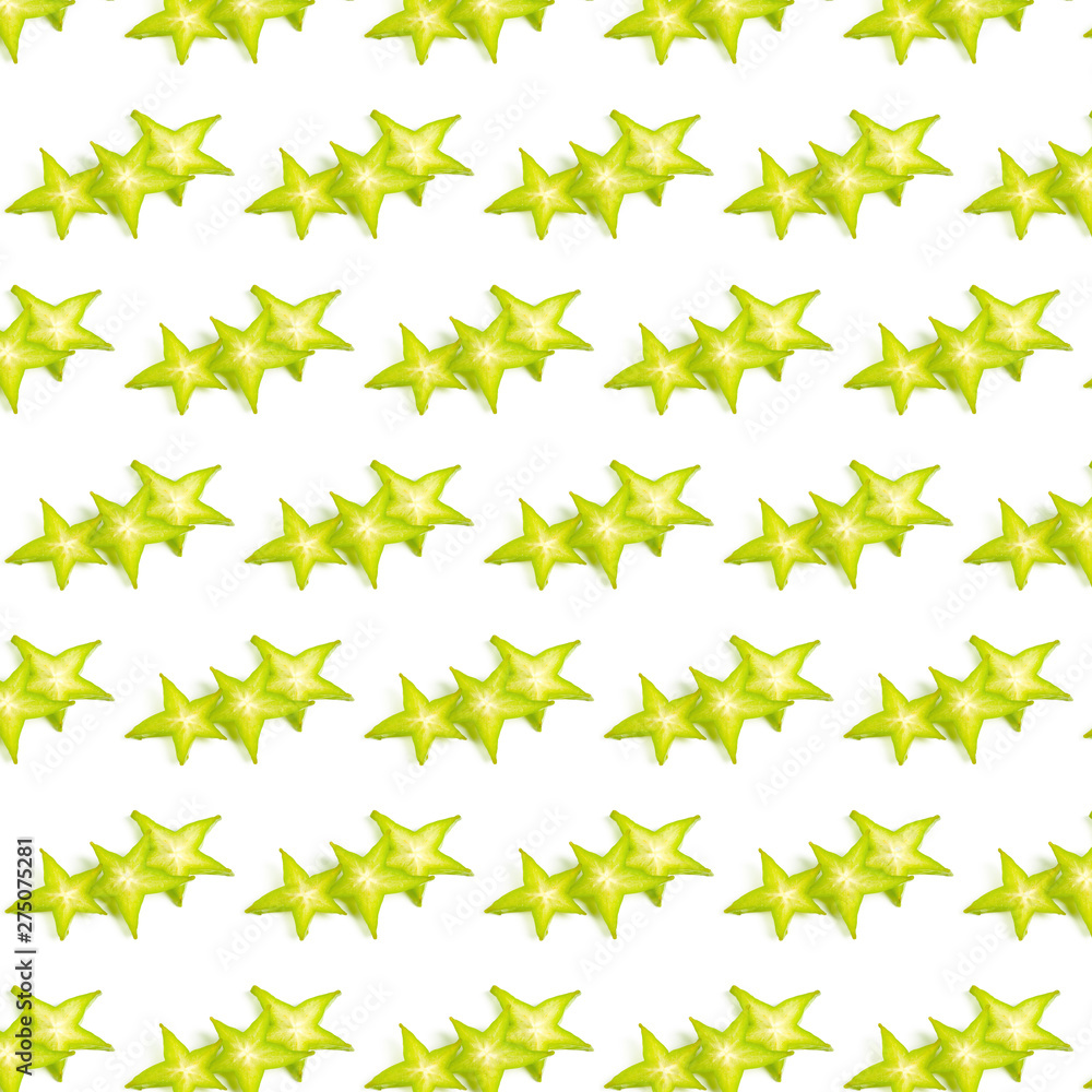 Fruit pattern. Carambola fruit (starfruit) slices isolated on white background Fruit pattern. Carambola fruit (starfruit) slices isolated on white background