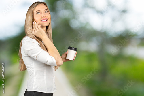 Business woman holding disposable cup