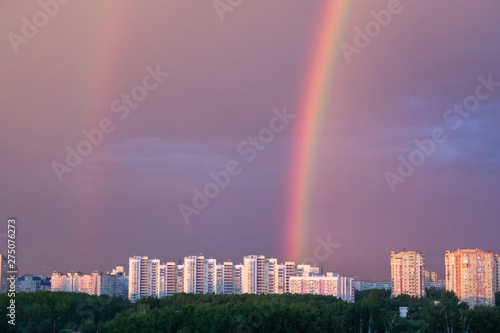 beautiful bright rainbow over the city