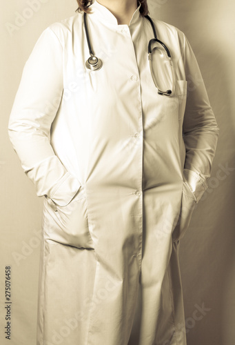 Woman doctor in uniform with a phonendoscope. Toned