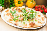 Traditional Italian pizza, vegetables, ingredients. Pizza is cooking in the oven. Pizza menu