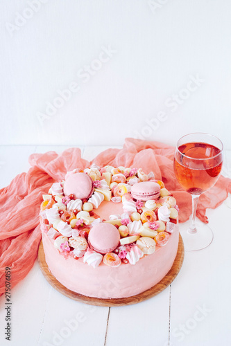 Pink cake. Decoration from sweets  macarons  marshmallows  white chocolate. Sweet birthday present. For girl.