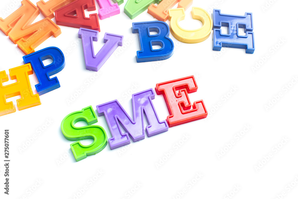 Heap of plastic colored alphabet letters close up. SME Heap of plastic colored alphabet letters close up. SME