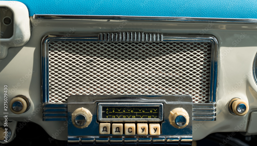 Old radio in a retro car. Old school. Old radio in a retro car. Old school.