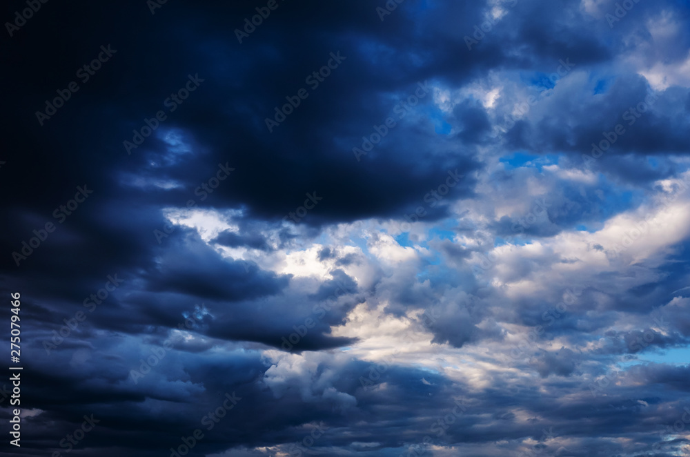The sky in the clouds after the summer thunderstorm. The amazing dramatic texture of the clouds, the background image. The sky in the clouds after the summer thunderstorm. The amazing dramatic texture of the clouds, the background image.