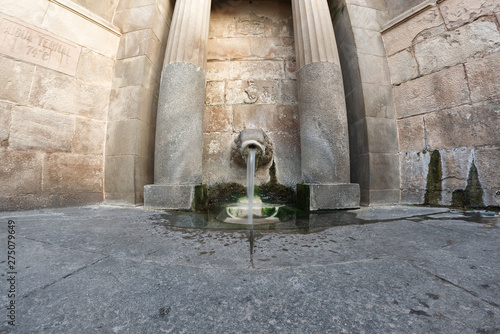 Lion's fountain also named Font del Lleó or Fuente del León in Caldes de Montbui. Hot thermal water spring near Barcelona.