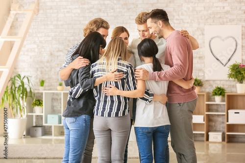 People hugging at group the...