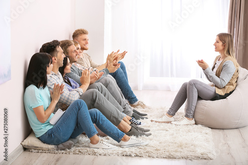 People clapping hands at group therapy session