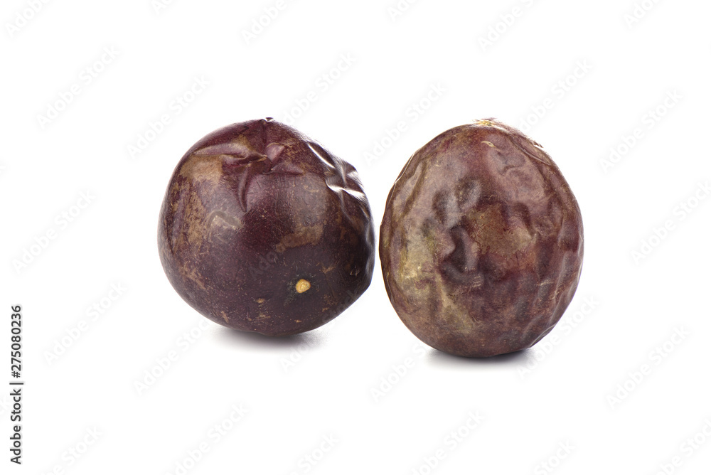 Obraz premium Two passion fruits on a white background. Copy space