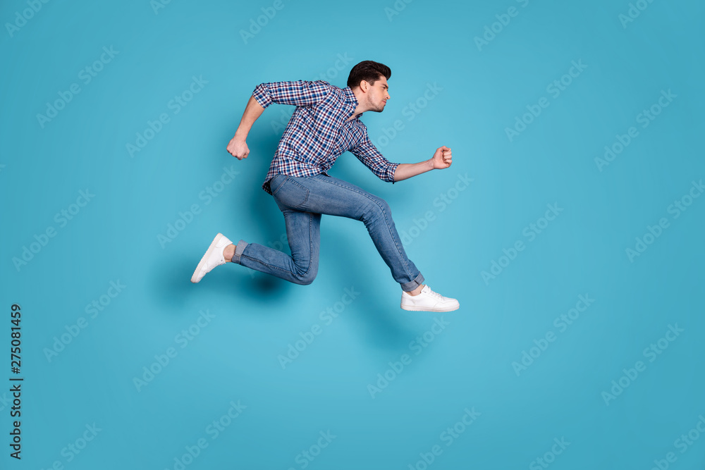 Full length body size view of concentrated athlete coach trainer do workout dressed fashionable outfit checked shirt denim sneakers isolated on blue background