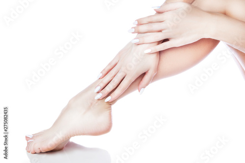 irl legs and hands, manicure pedicure, smooth healthy skin. Isolated. White background. Copy space