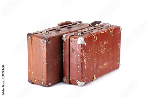 two leather brown aged vintage suitcases isolated on white