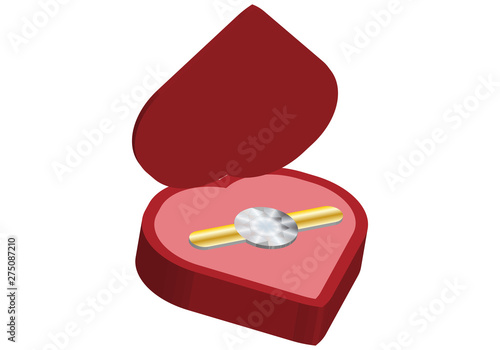 Anillo en una caja con forma de corazón.